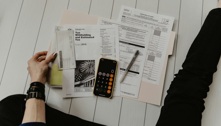Reviewing financial documents with a calculator